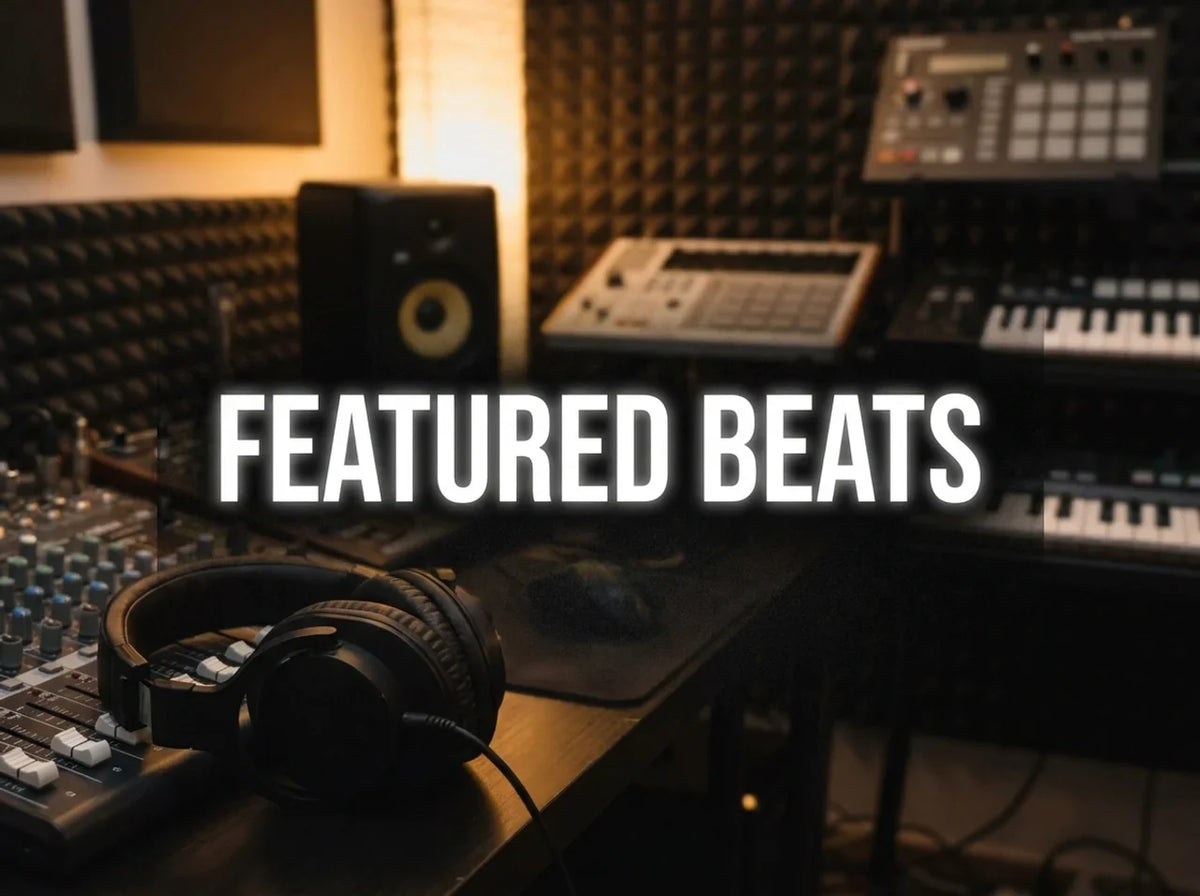 A beautiful modern music studio with headphones and keyboards and a mixing board