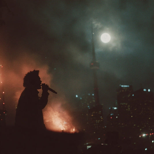 Person singing into a microphone with city skyline and fireworks in the background