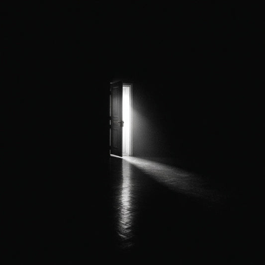 Dark room with a door opening to a bright light