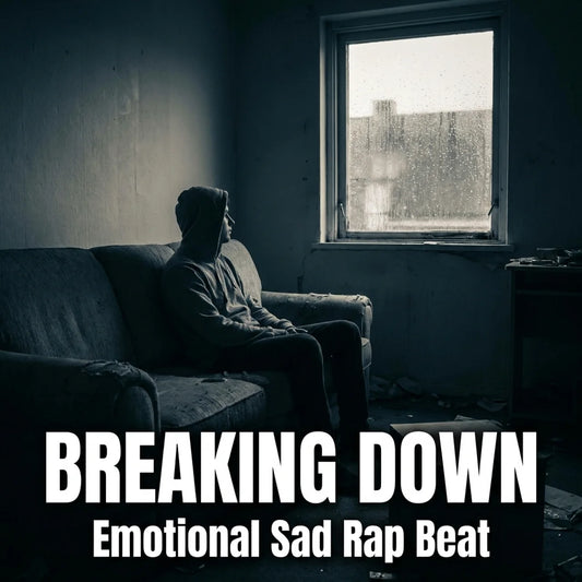 Dark moody album-style artwork showing a person sitting on a worn couch in a dim room, looking out a window. Large white text at the bottom reads 'BREAKING DOWN' with smaller text 'Emotional Sad Rap Beat'.